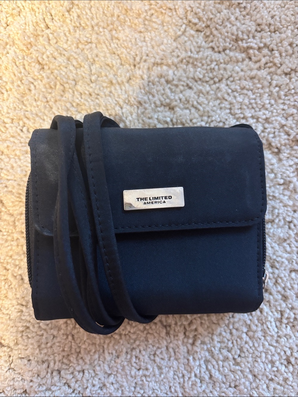 The Limited Black Crossbody with Metal Logo Plaque
